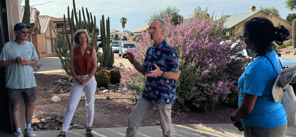 Democratic state legislative candidate John McLean speaks to volunteers before an organized canvas. To his left is Kristin Engel, Democratic nominee for Arizona’s 6th Congressional District, and to his right is state Sen. Priya Sundareshan, co-chair of the Arizona Democratic Legislative Campaign Committee. | Photos by Liz Crampton/POLITICO