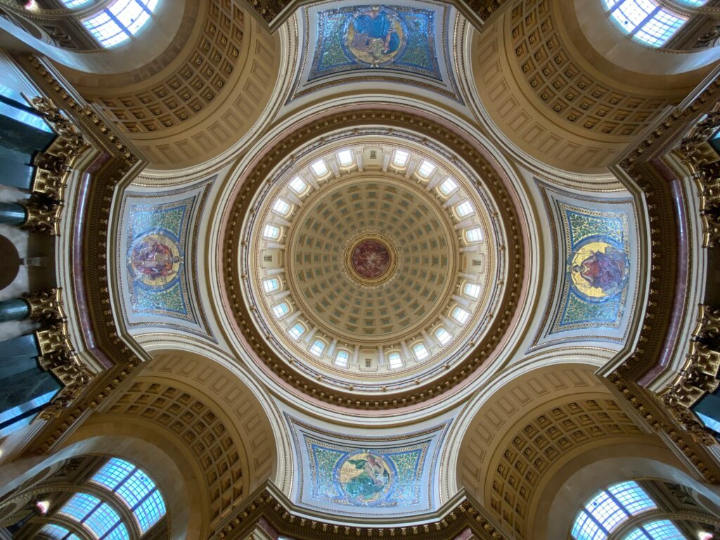 Looking up at the ornate ceiling inside the Wisconsin State Capitol rotunda